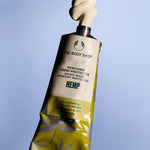 The Body Shop hemp hand protector tube on a blue background
