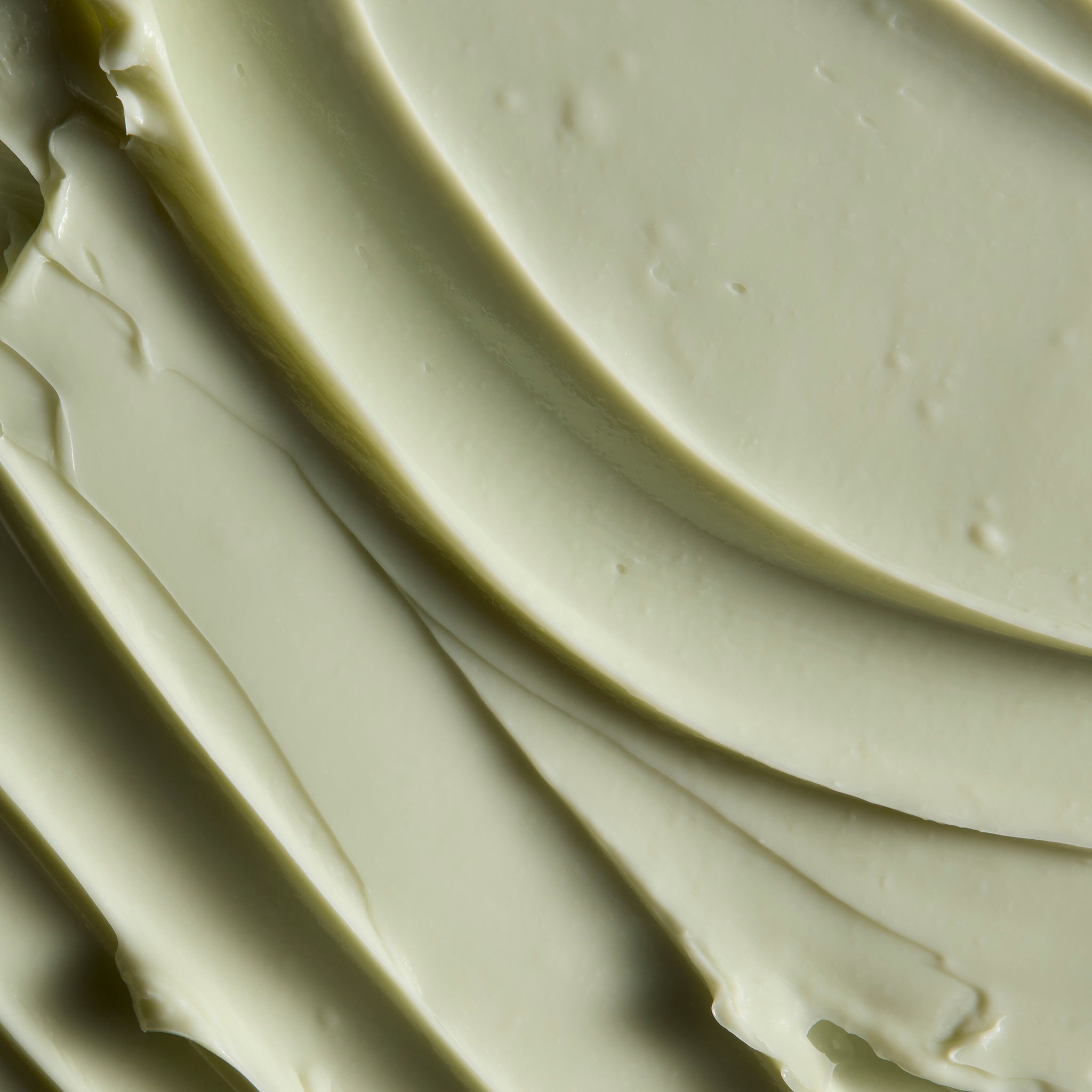 Close-up of smooth Hemp body butter cream, showing soft swirls and a rich, creamy texture | The Body Shop
