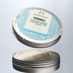 The Body Shop Camomile Sumptuous Makeup Cleansing Butter with lid removed on a light gray background