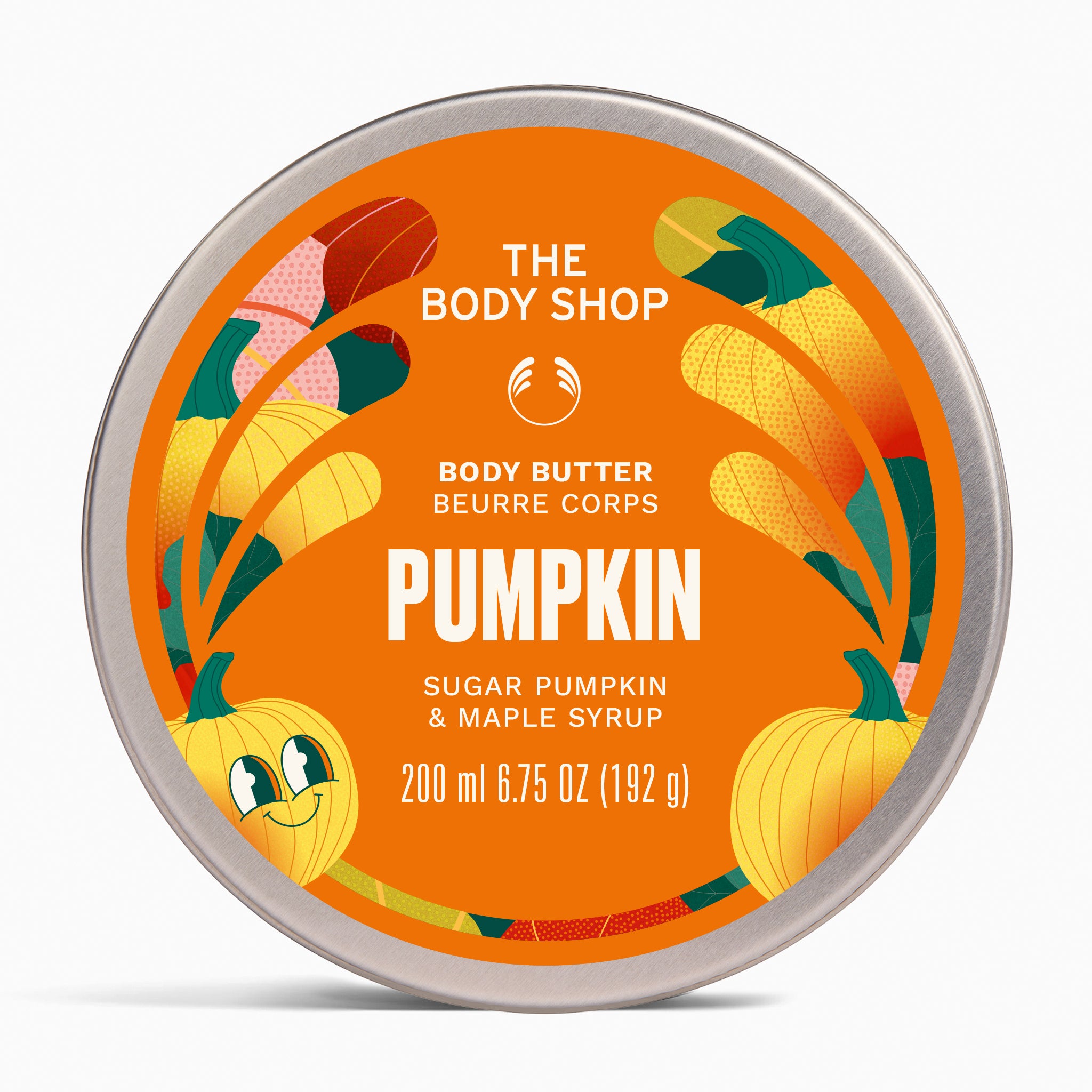 A round tin of The Body Shop Body Butter in the Pumpkin scent, featuring a bright orange label with illustrations of pumpkins and maple leaves on a light gray background.
