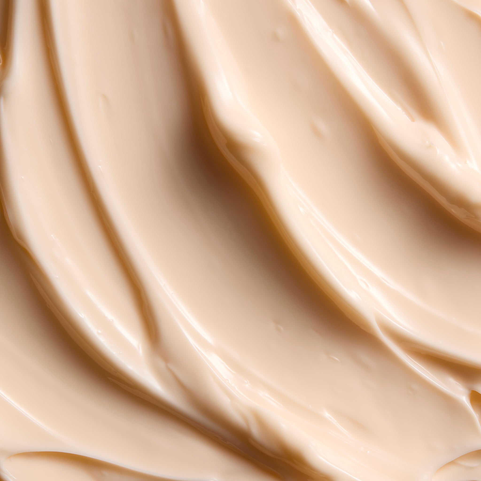 Close-up of smooth Satsuma body butter cream, showing soft swirls and a rich, creamy texture | The Body Shop