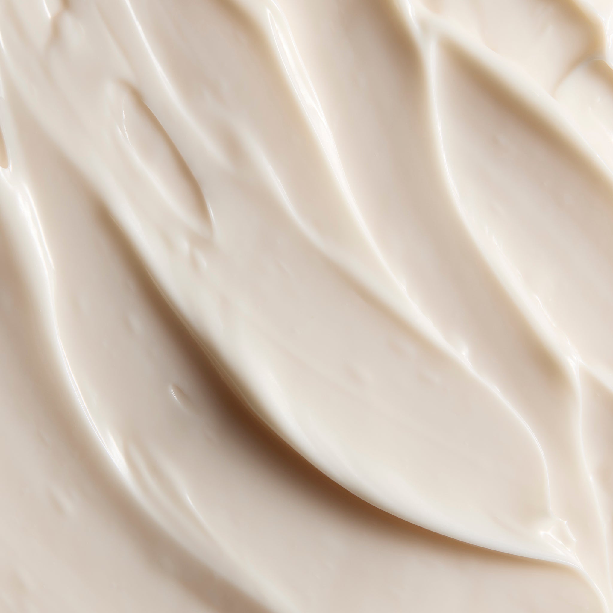 Close-up of smooth Grapefruit body butter cream, showing soft swirls and a rich, creamy texture | The Body Shop