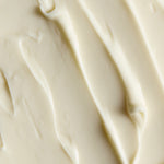 Close-up of smooth Moringa body butter cream, showing soft swirls and the texture | The Body Shop