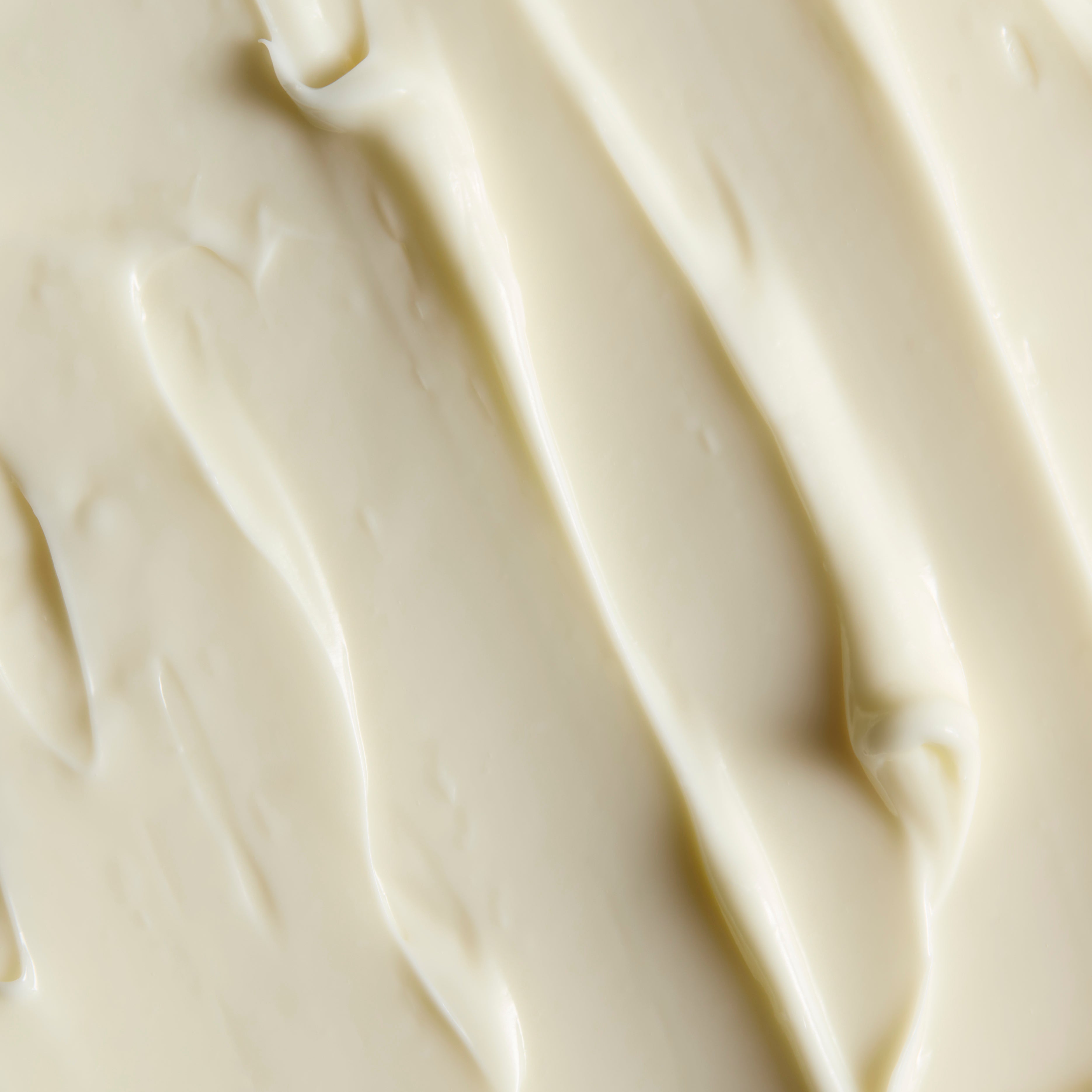 Close-up of smooth Moringa body butter cream, showing soft swirls and the texture | The Body Shop