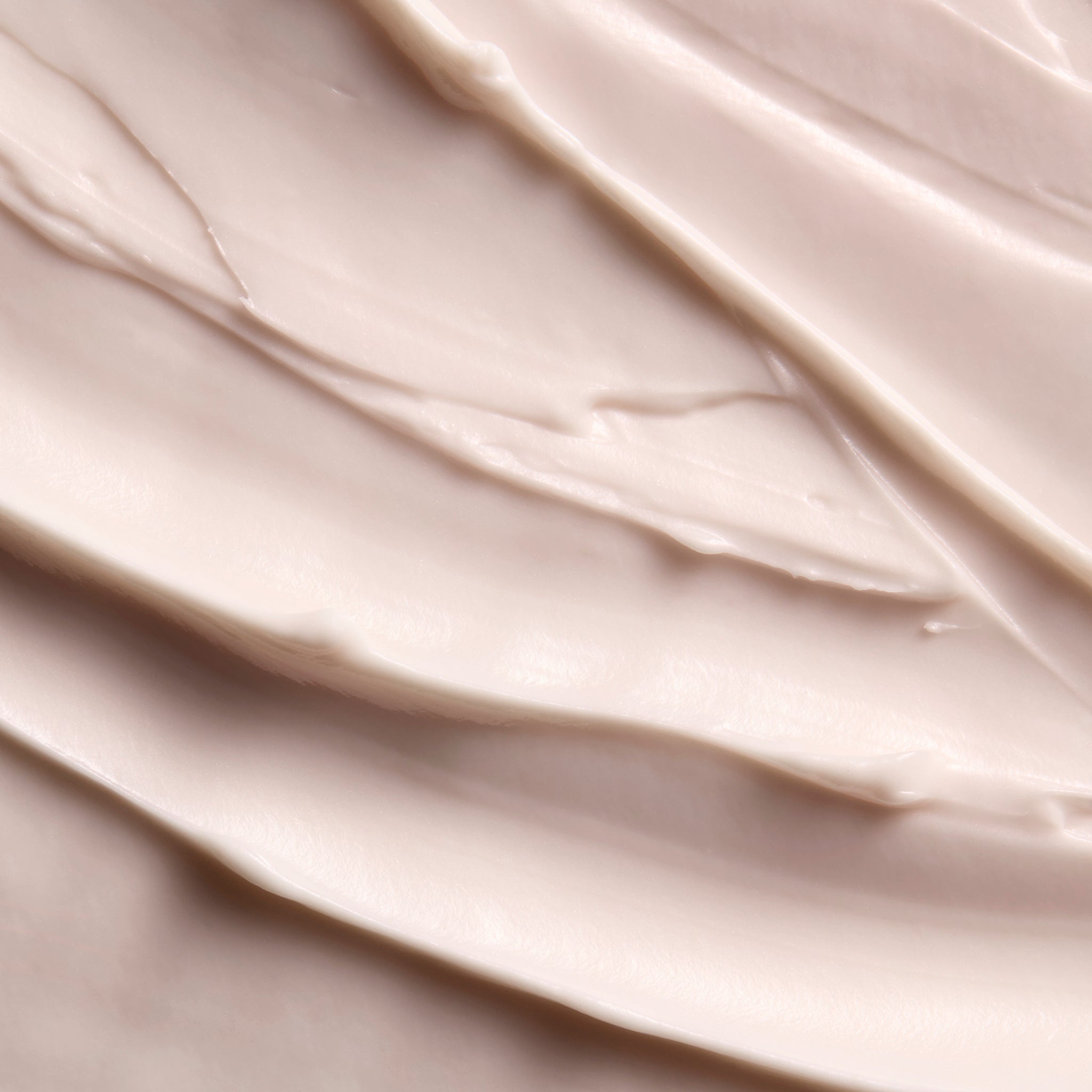 Close-up of smooth British Rose body butter cream, showing soft swirls and a rich, creamy texture | The Body Shop