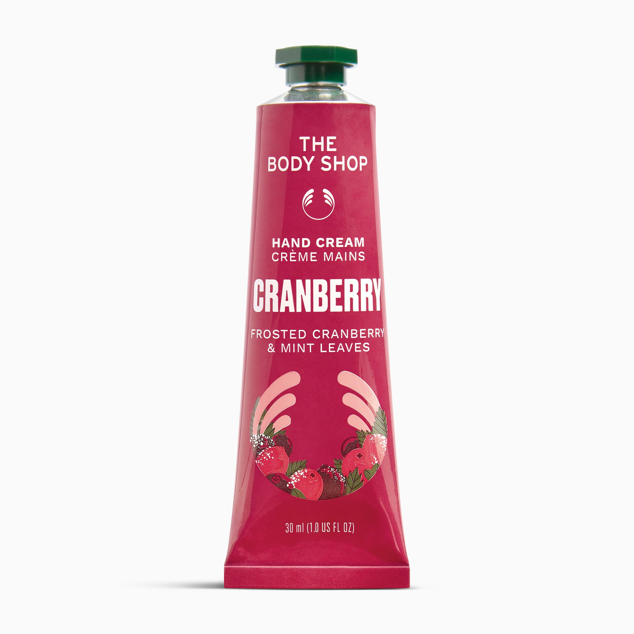 A squeeze tube of The Body Shop Hand Cream Creme Mains in Cranberry, featuring a deep pink-red tube with white text, a green cap, and illustrations of strawberries and hands at the bottom, set against a plain white background.