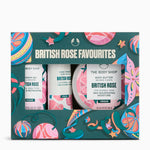 The Body Shop British Rose Favourites gift set in a decorative teal box with pink, blue, and yellow illustrations. The set includes a body wash, hand cream, and body butter, all labeled British Rose.