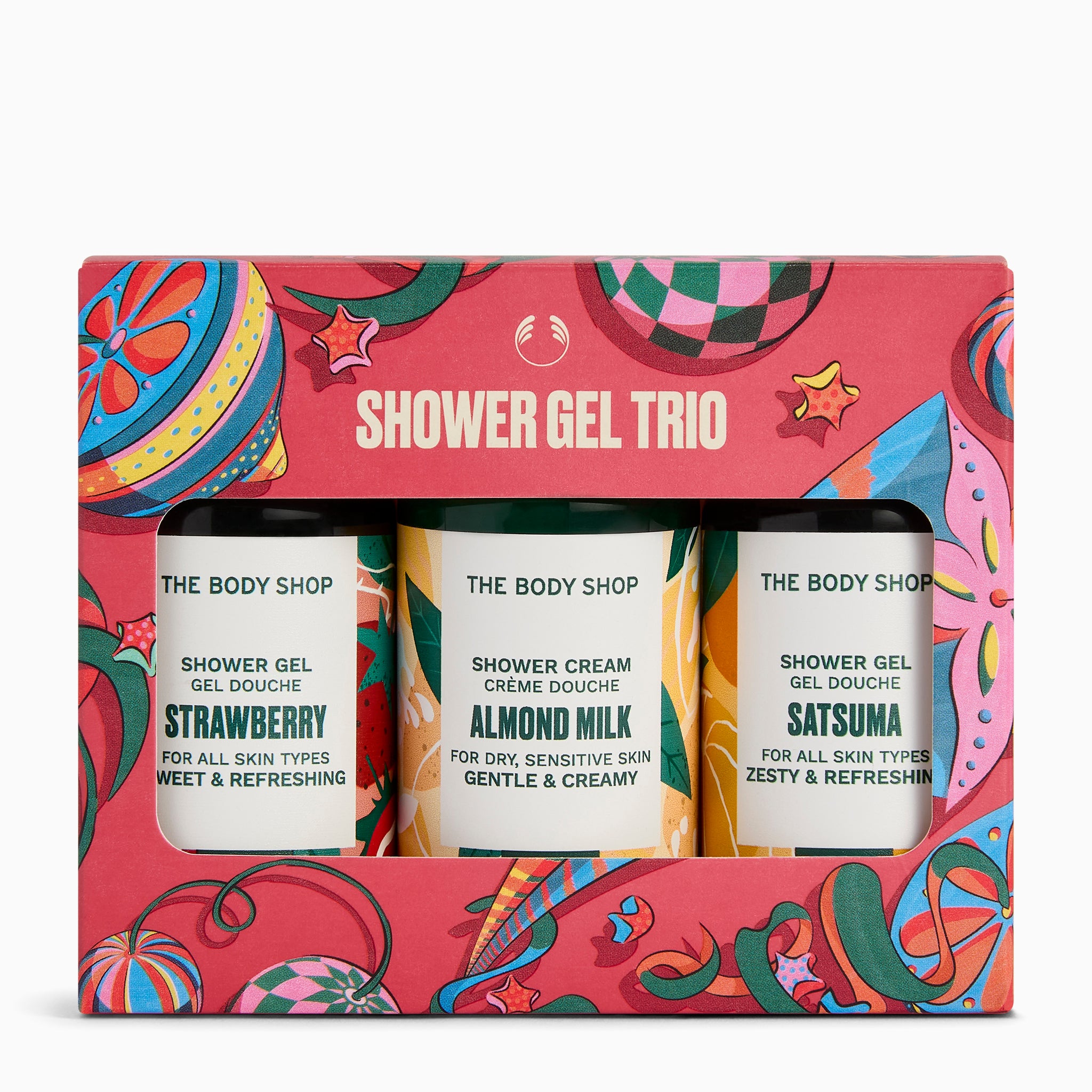 The Body Shop Shower Trio gift set in a bright red patterned box, containing three small shower gel bottles labelled Strawberry, Almond Milk, and Satsuma.