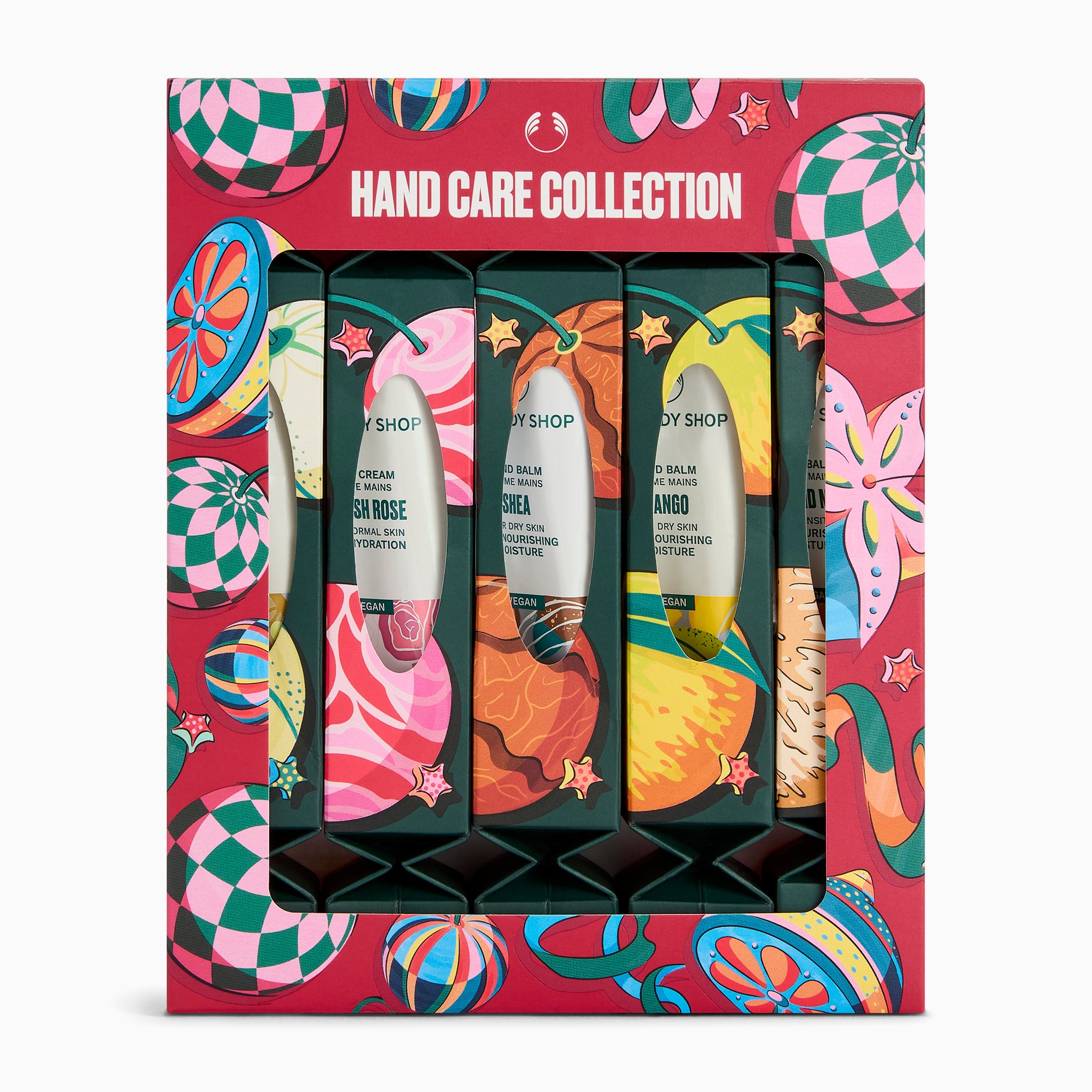 A boxed hand care gift set from Body Shop featuring four tubes of hand cream and hand lotion in a decorative red package with colorful fruit and abstract illustrations and the text 'HAND CARE COLLECTION'.
