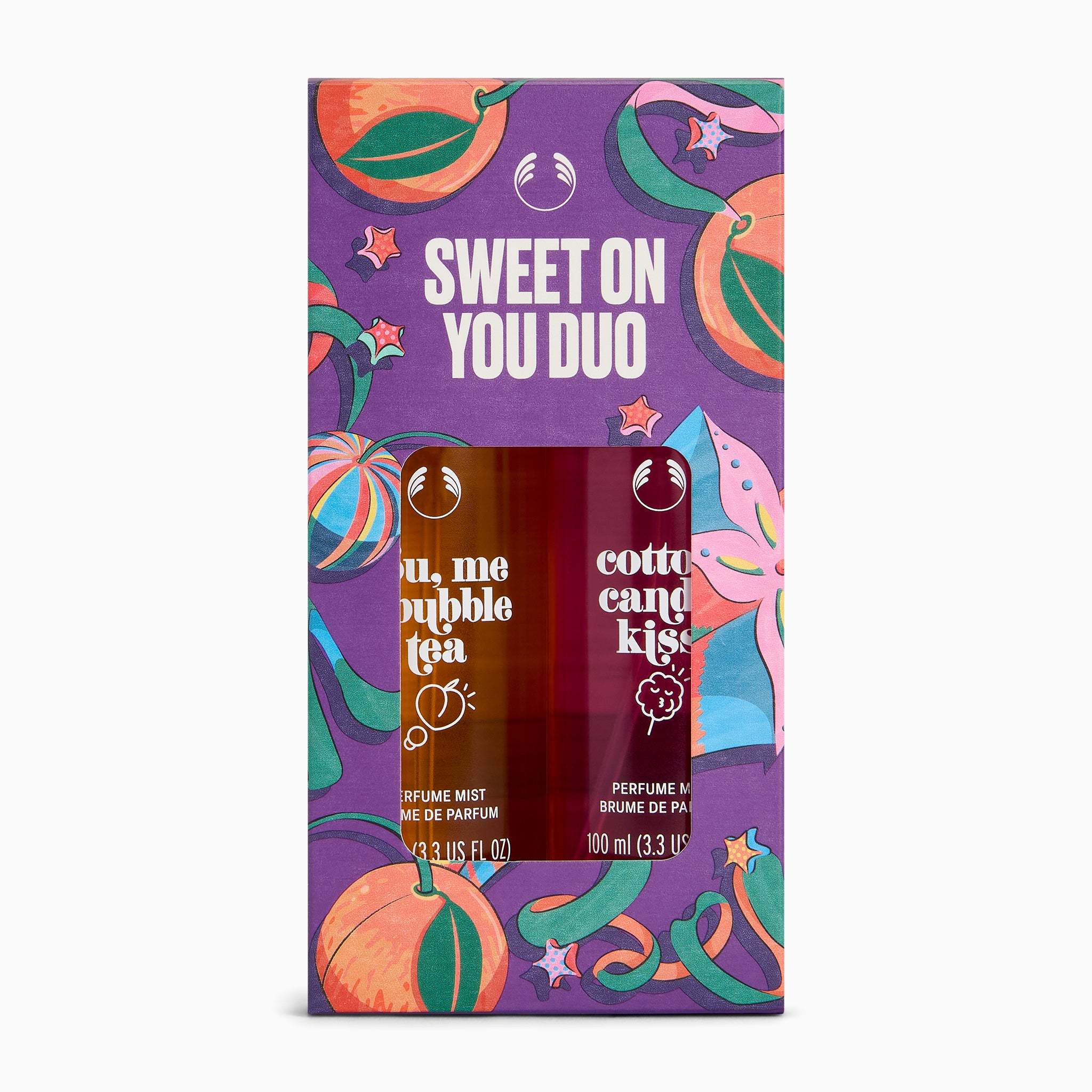The front of a purple retail box for a fragrance duo set, with colorful illustrated fruit and ribbon graphics and the text 'SWEET ON YOU DUO.' Two perfume mist bottles are visible through the front window: 'you, me bubble tea' and 'cotton candy kiss.