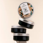 The Body Shop Shea body butter jars on a beige background