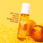 You, Me & Bubble Tea Fragrance Mist - The Body Shop, leaning against two peaches. Overlay text 'Get that fruity peach bubble tea feeling'.