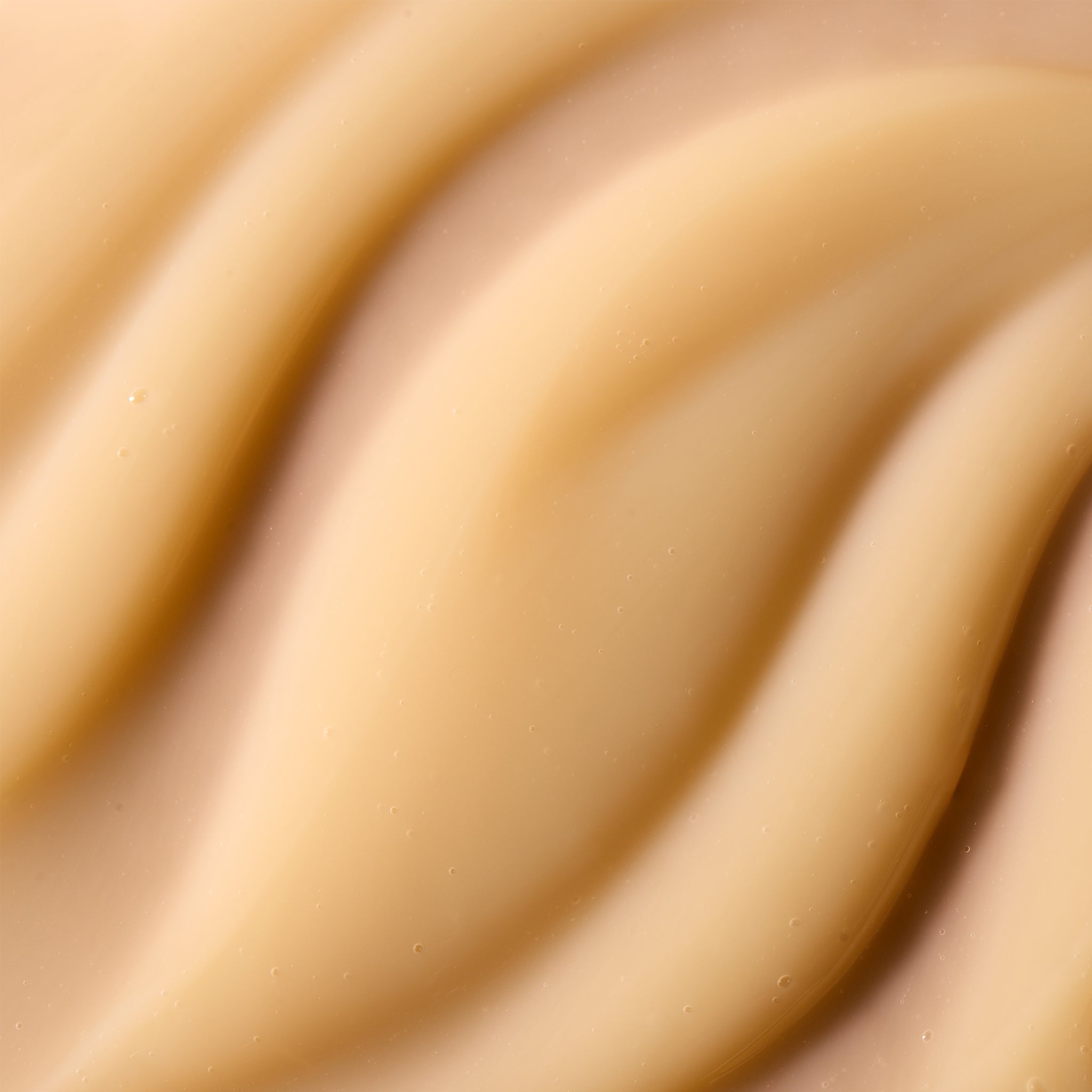 A close-up texture shot of a smooth, creamy Pumpkin shower gel, the body shop. 