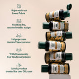 A stack of The Body Shop Ginger Shampoo bottles with a list of product benefits. Helps wash out loose flakes. Soothes dry, uncomfortable scalps. Helps prevent dandruff reoccurrence. With Community Fair Trade ingredients. Iconic product trusted for over 30 years.