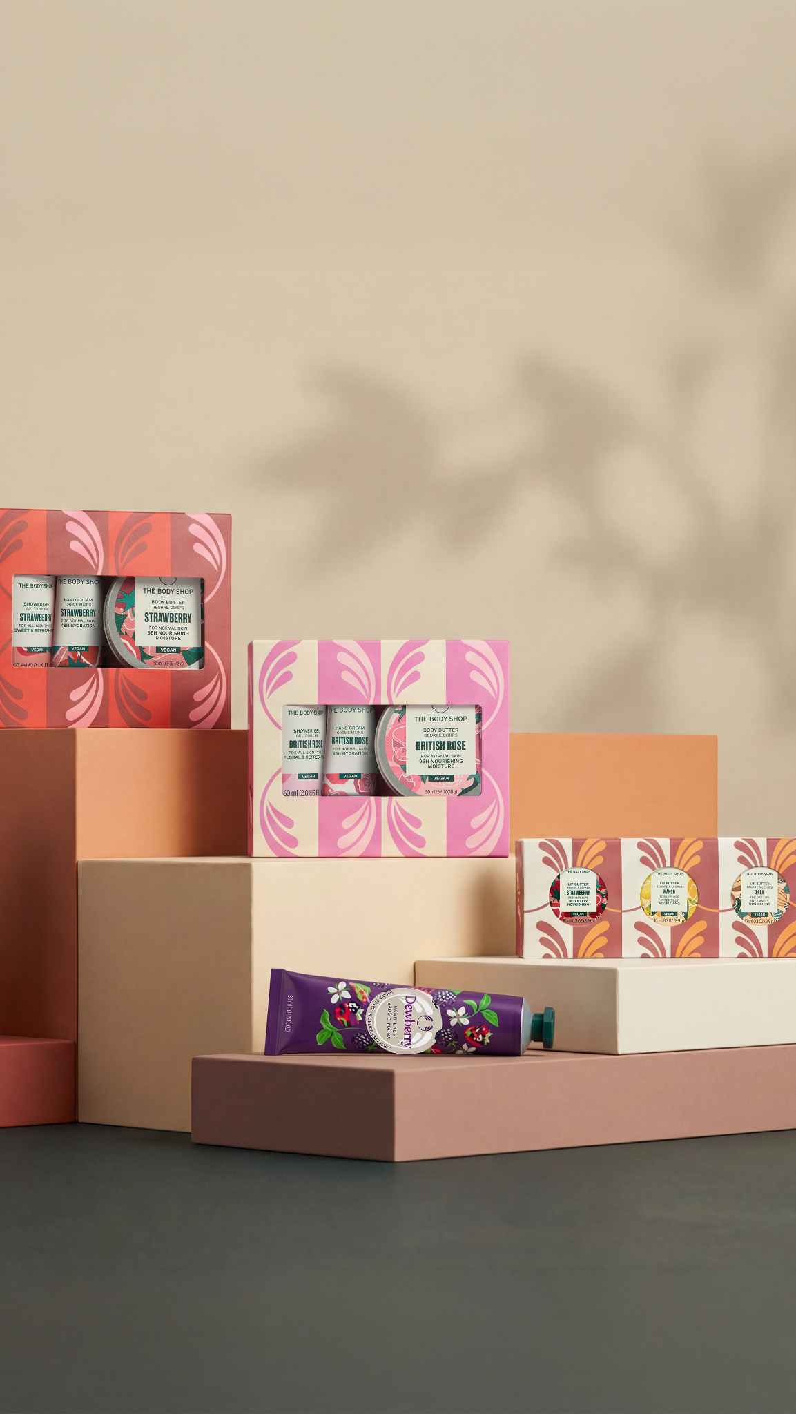 Collection of skincare products and boxes on a neutral background