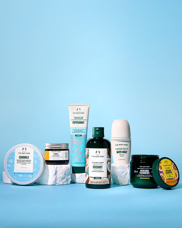 Collection of The Body Shop products on a blue background