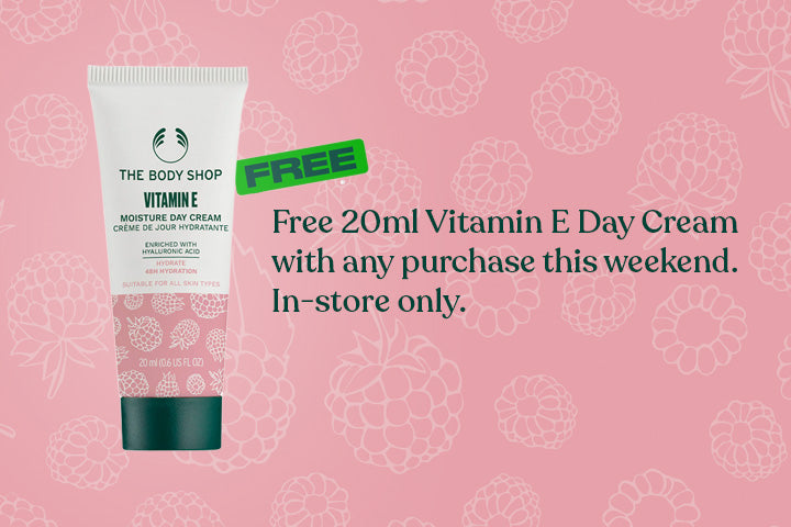 The Body Shop Vitamin E Day Cream with promotional text on a pink background