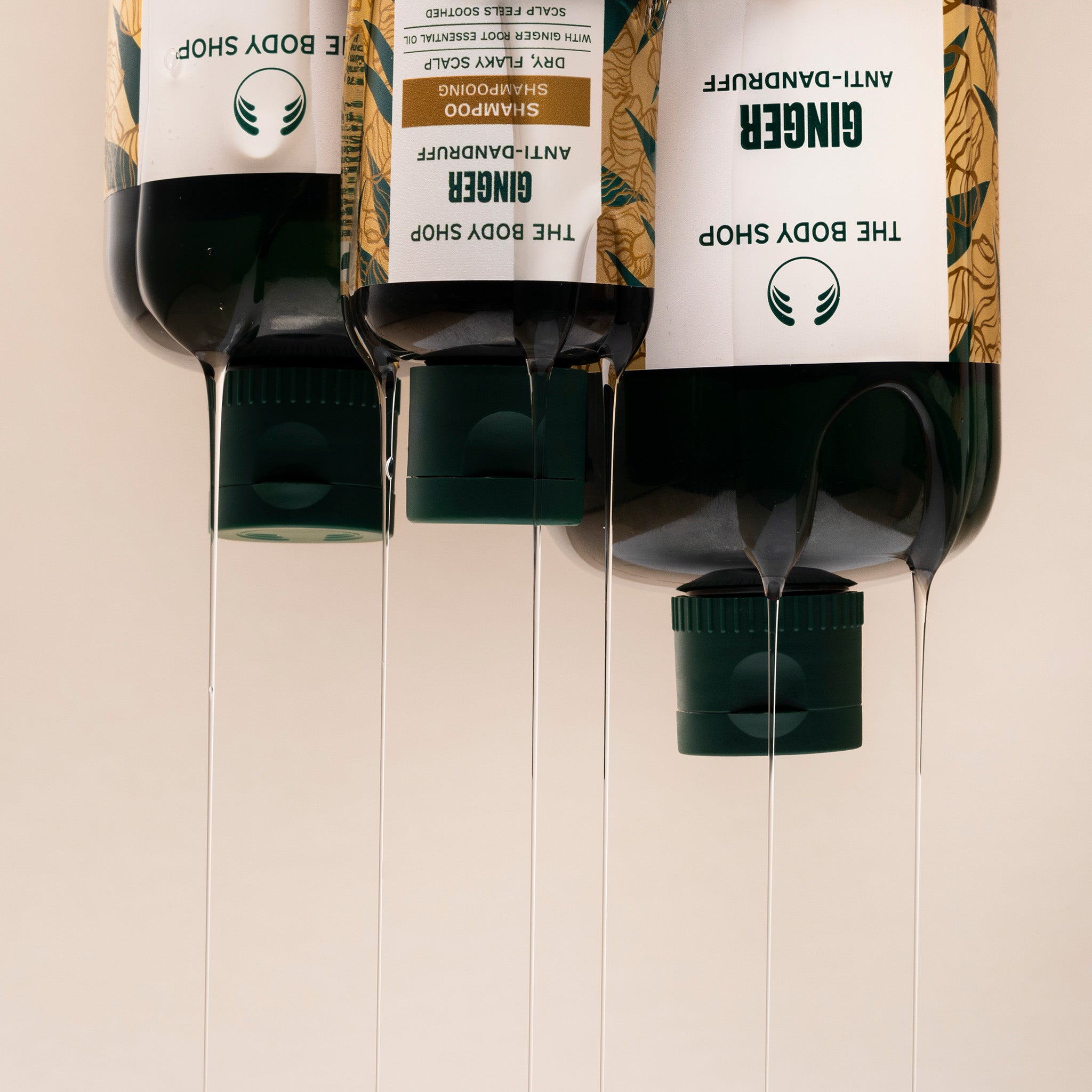 Three bottles of The Body Shop Ginger shampoo